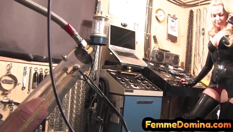 Latex BDSM femdom drains sissy cock with milking machine