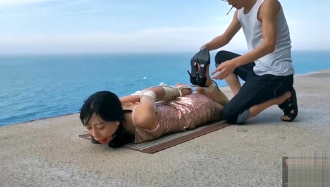 Chinese girl public bondage seaside