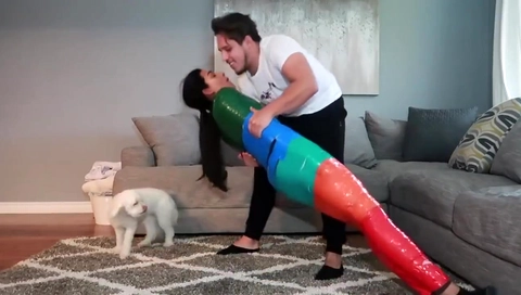 Girl is mummified in multi-colored duct tape and can't get loose