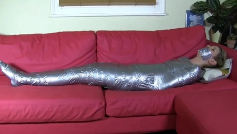 Blonde mummified on sofa
