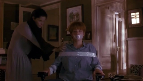 Girl taped to a chair
